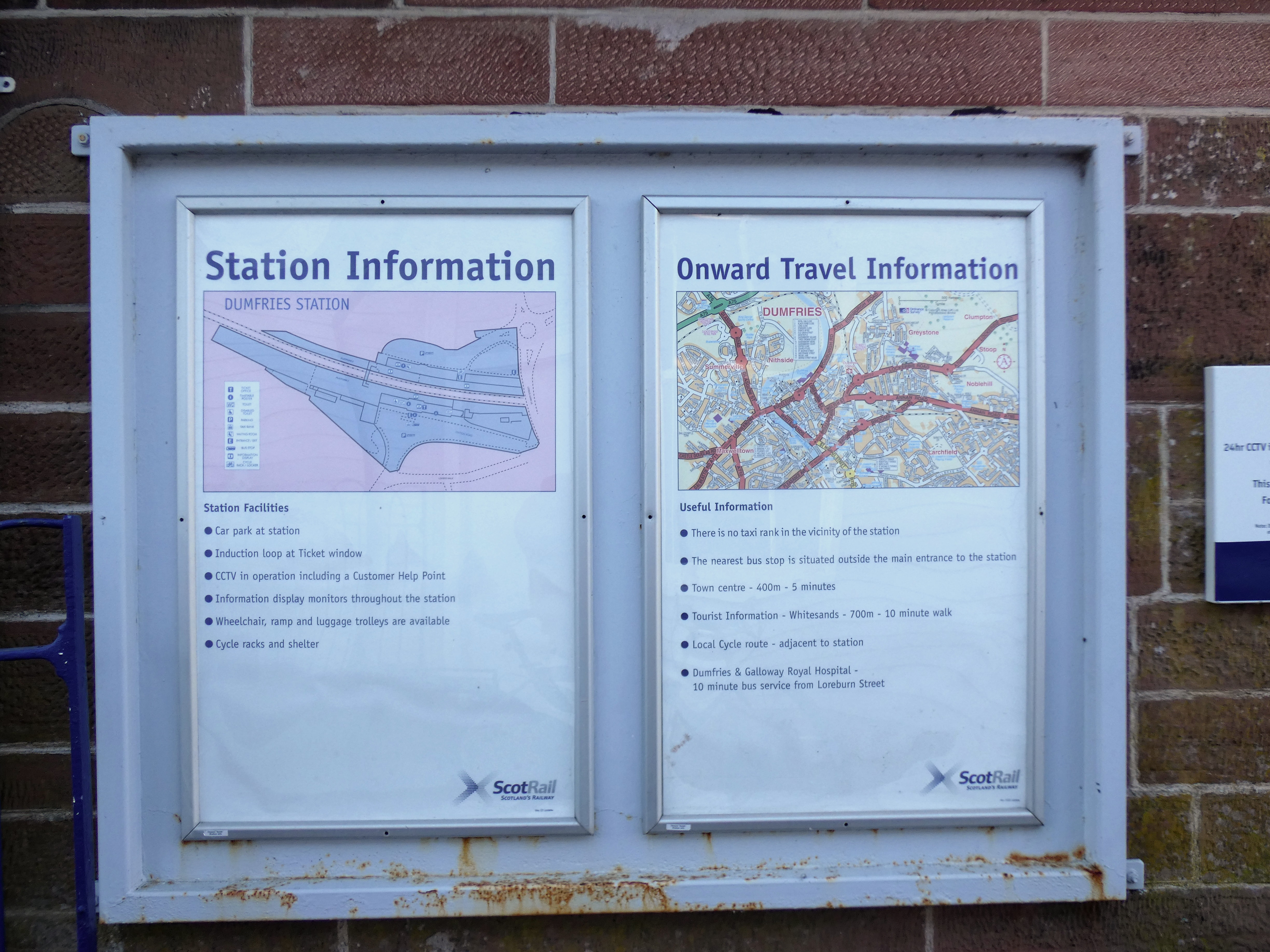 Station Information and Onward Travel Information posters at the station