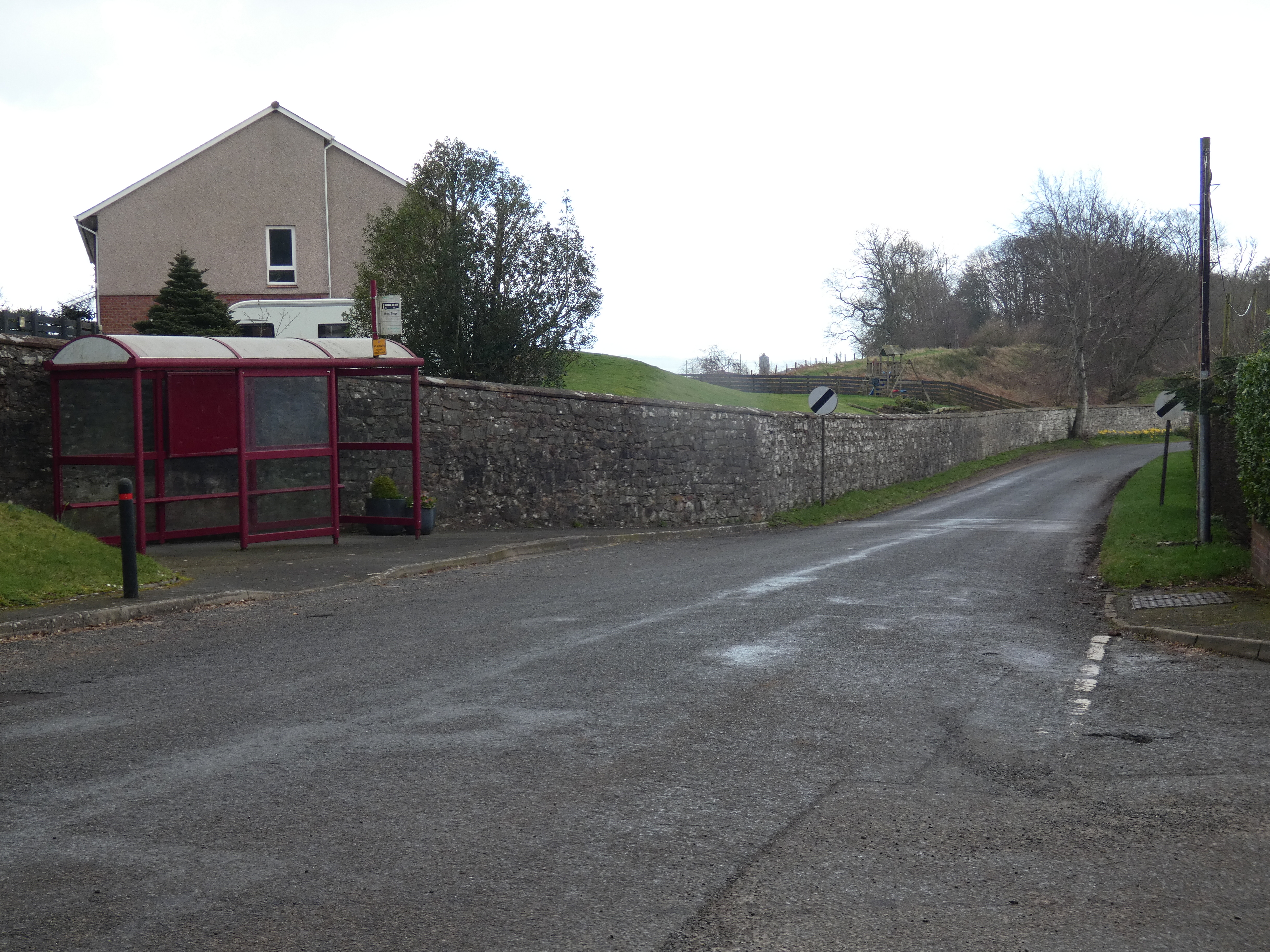 Road out of Terregles with national speed limit sign