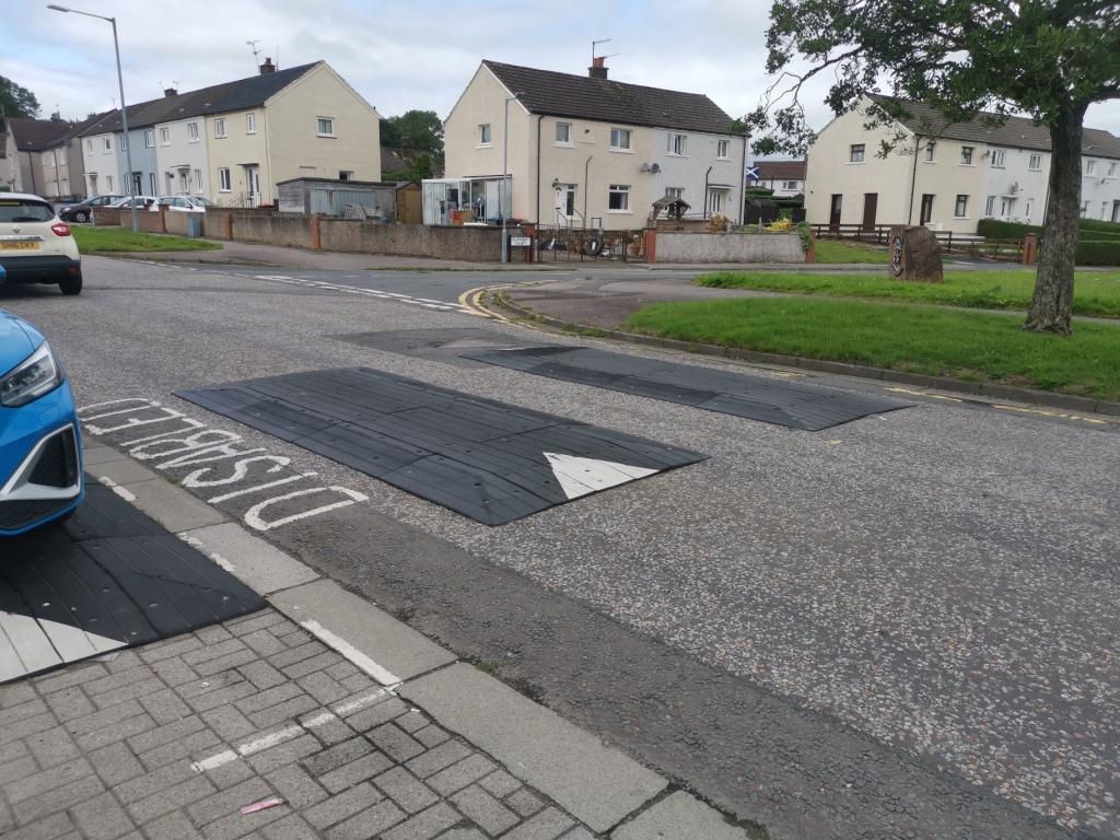 Lochside Road with speed cushions extending into a disabled parking bay