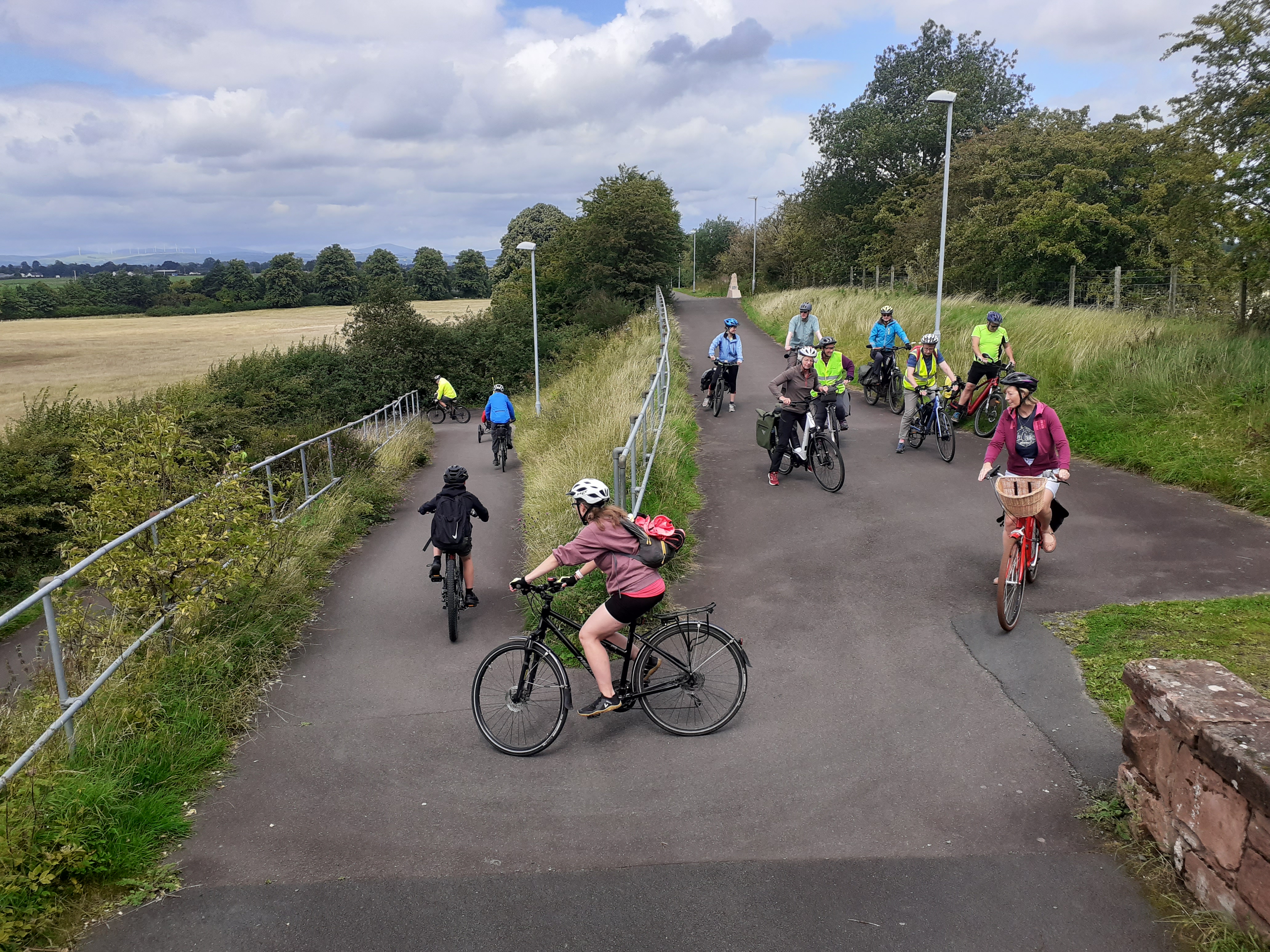 A people cycling in a large group.