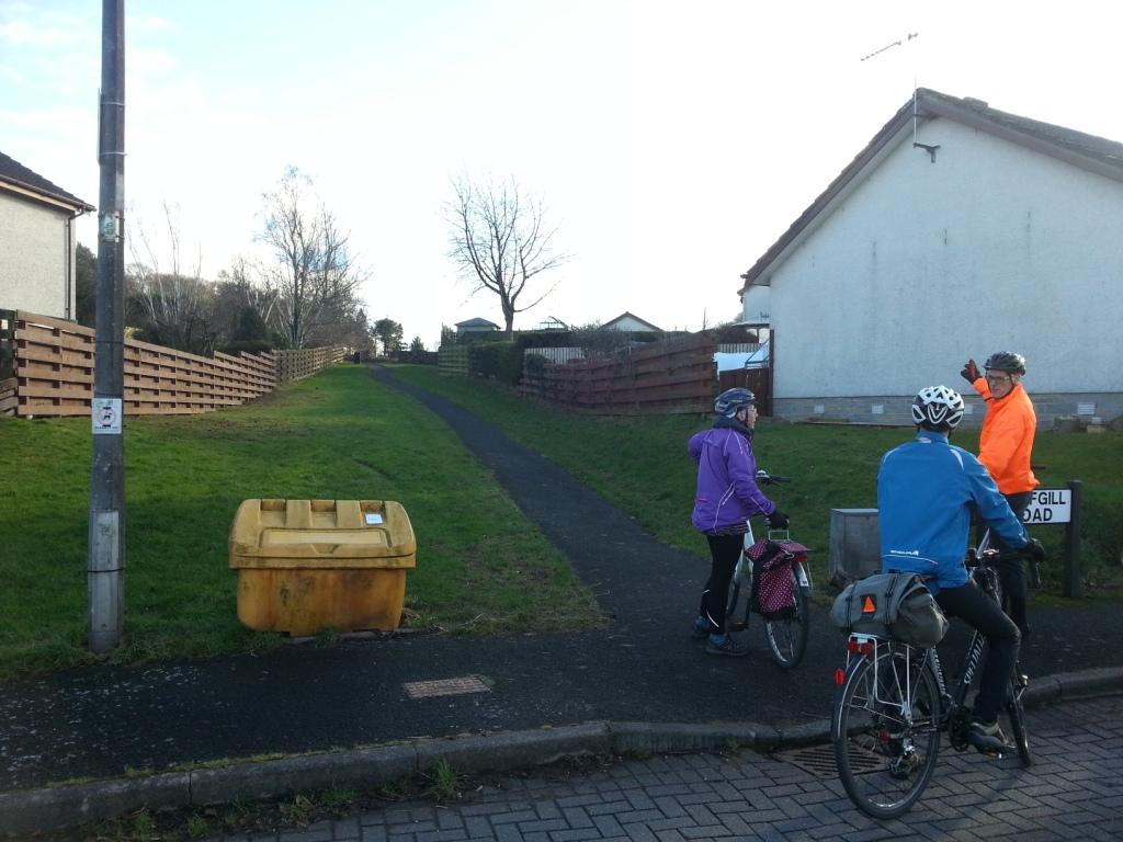 Cyclists looking at the path that leads up to Craigs Road