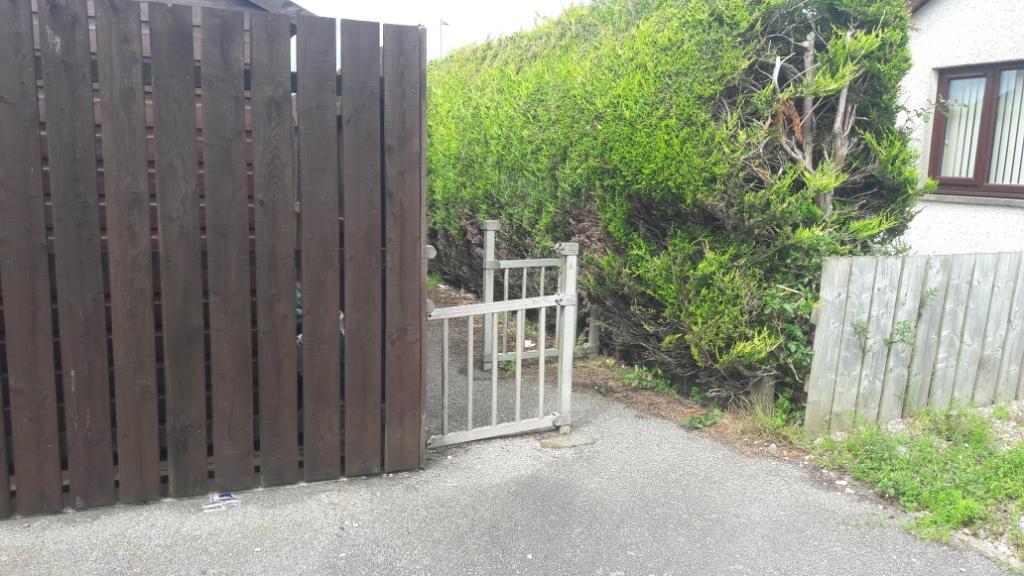 Very narrow path made even narrower by a chicane barrier