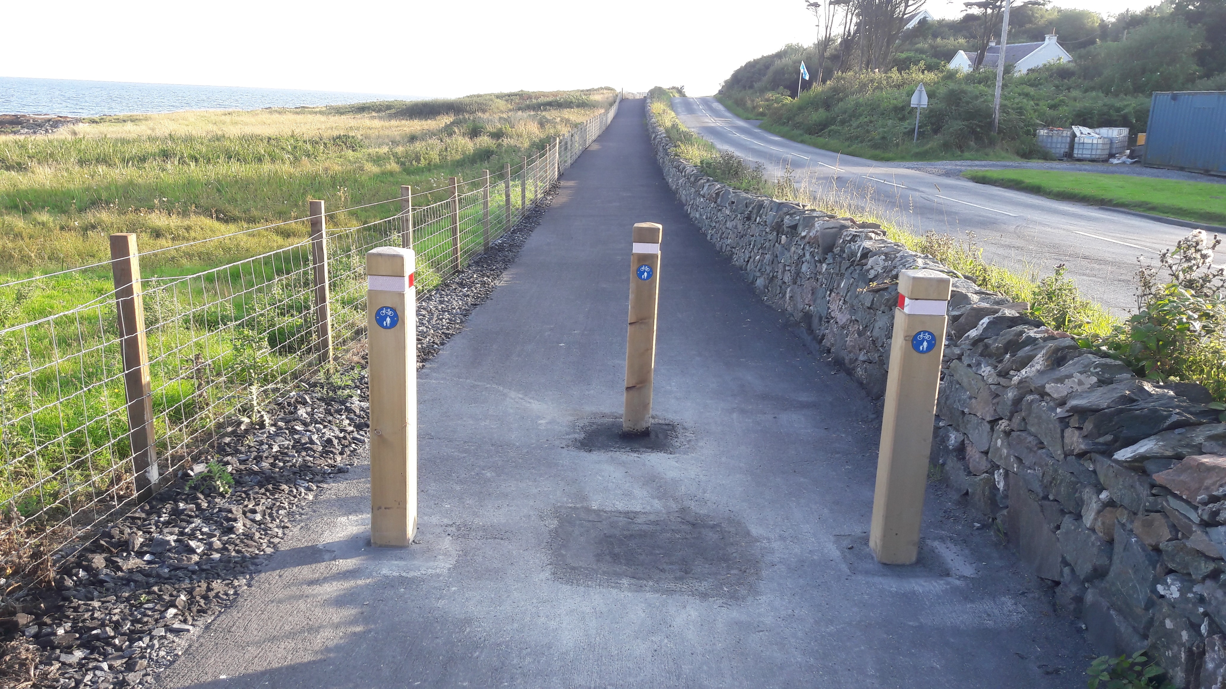 Entrance to a rural path alongside a road on Islay